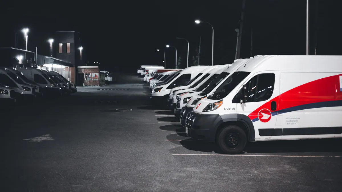 A line of delivery vans parked up for the night.